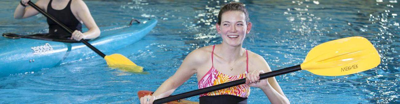 Students kayaking in pool